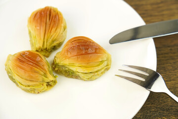  Turkish Midye Baklava  ( Mussel Shape Baklava ) with green pistachio nuts.  