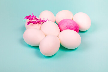 Easter. White eggs with red, on a uniform blue background.