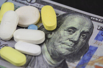 Money and pill, pharmacy concept