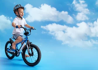 Foto op Canvas Picture of little boy riding a bike - riding lesson © konradbak