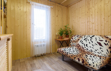 Interior of a small modest living room of a country house