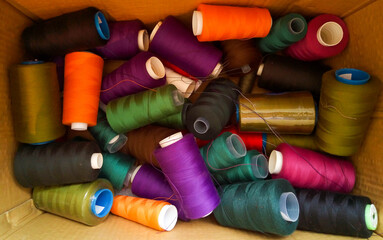 Sewing multicolored threads are in the box