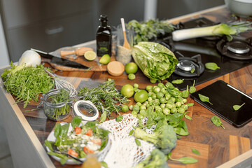 Healthy food on kitchen with woman on background