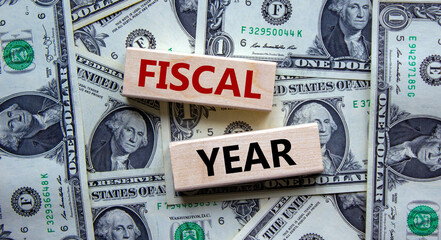 Fiscal year symbol. Concept words 'fiscal year' on wooden blocks on a beautiful background from...