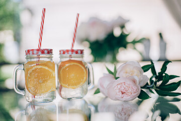 Still life of refreshing drinks and flowers