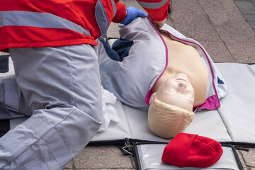 Instructor Showing Resuscitation Technique On Dummy. Urgent Care.