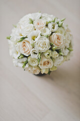 Delicate wedding bouquet in pastel colors of roses and buds 2507.