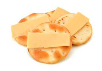 Whole wheat cracker and cheese, isolated on white background, close-up.