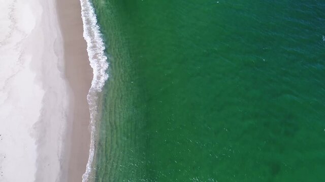 tilt up reveal of the coast of monomoy island off cape cod from a drone