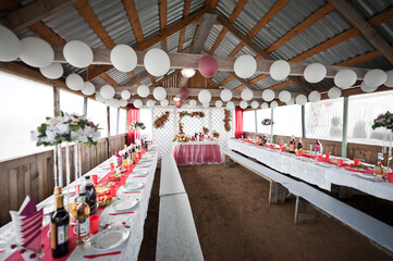 A place for nelyweds on a holiday with a background decorated with flow