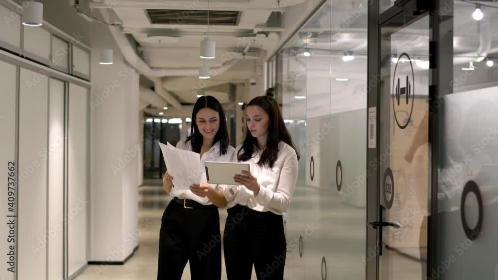 Poster confident caucasian colleagues analyzing accountings using touch pad for web browsing in office work