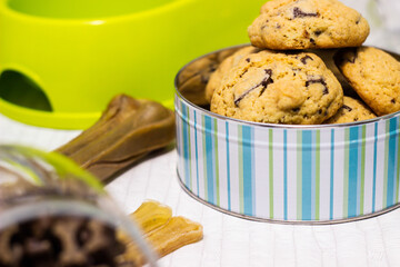 Dog treats spilling out of bowl. Dog treats and biscuits