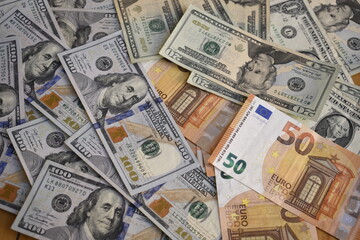 banknotes of dollars and euros in disorder
