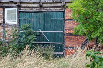 Rural, primeval, rustic, the old green barn door on the abandoned farm sends us back to a time when...