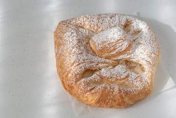 Austrian pastry filled with cheese, coated with sugar, on white background, viewed high angle view - Powered by Adobe