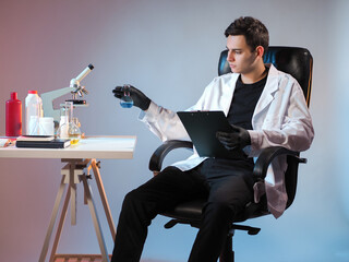 Man works in a chemical laboratory. Male researcher conducting scientific research in laboratory....
