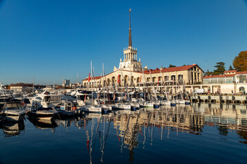 Fototapeta premium The building of the sea station in Sochi on a sunny day with a view of the yachts.