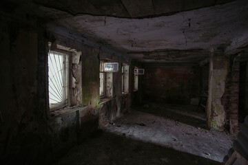 Interior of messy dirty room at old abandoned building
