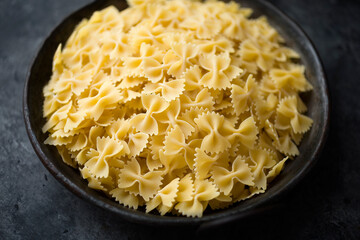 italian farfalle pasta raw uncooked blur defocused