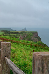 Cliffs along the Gower Peninsula, Wales. Beach cliffs and sea. 