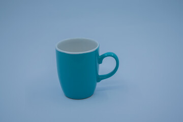 Turquoise colored porcelain cups on white background.