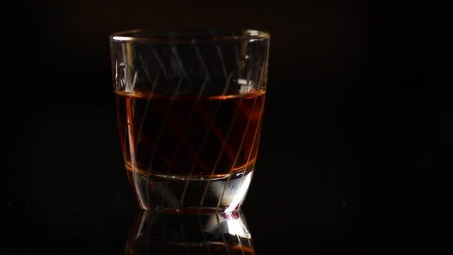 A shot of schnapps is placed on the table