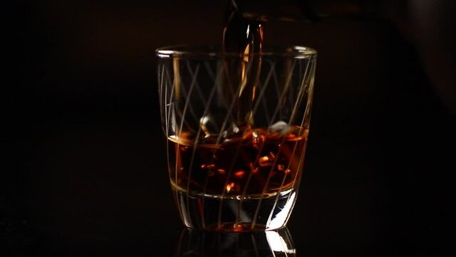 a shot is poured in slow motion