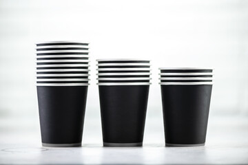 Paper cup of coffee on white background
