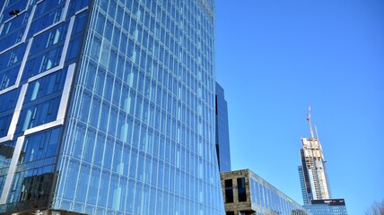 View of skyscrapers during snowfall.Urban cityscape and modern architecture background. 