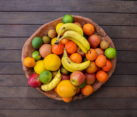 Huge bowl full of colorful and tasty fruits. All vitamins in one plate.