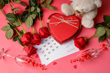 Valentine day. Red hearths and roses on Calendar page. February 14 of Saint Valentines day. Pink...