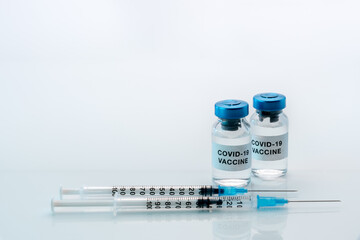 Coronavirus COVID-19 vaccine. Vials with syringes isolated on white background,concept composition with copy space