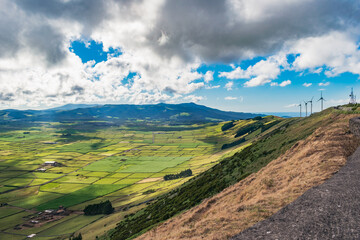 Panorama of the famous Serra do Cume and pastures divided by volcanic stone walls with dramatic sky, Terceira - Azores PORTUGAL