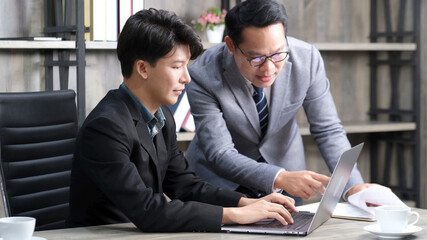 Asian businessmen discussing about business plan, Asia male team analyze business data at office