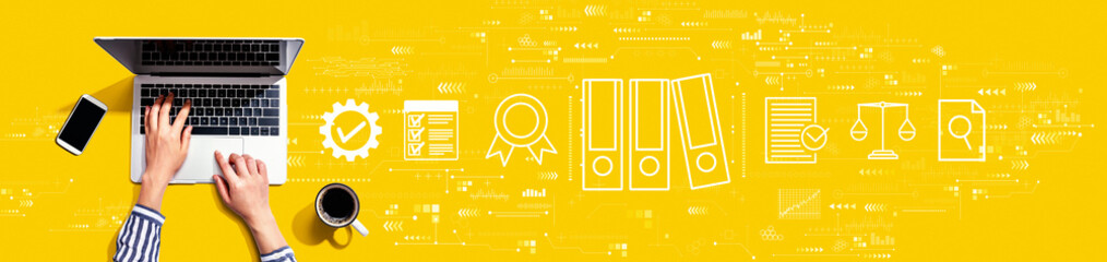 Compliance theme with person using a laptop computer