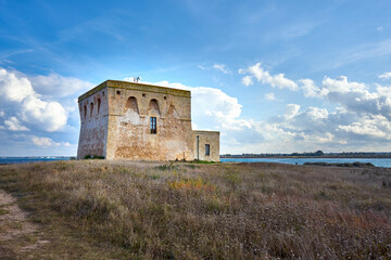 Fototapeta na wymiar XVI Century Antique Defensive Tower Torre Guaceto At In The Middle Of A Natural Reserve Along The Coast Of Apulia Italy