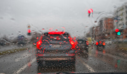 Cars driving on rainy day  - 409765098