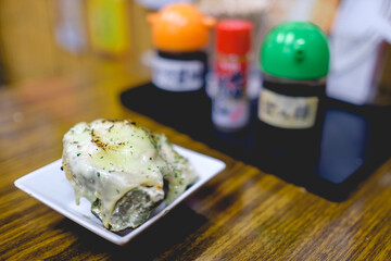 Oyster with cheese at traditional restaurant, Miyajima Island, Japan