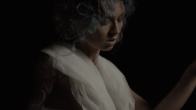 Tattooed Woman Dressed As Azazel Dancing In Dark