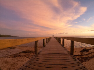 Obraz premium pier over the water at sunset