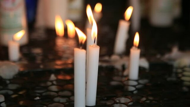 salvador, bahia, brazil - january 31, 2021: lit candles are seen in a catholic church in the city of Salvador.