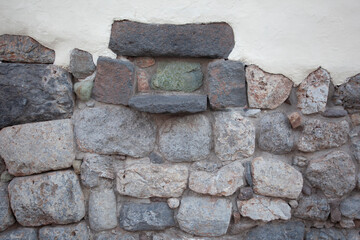 Stone wall of houses in the city of Cuzco, Peru. July 25, 2016