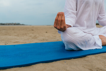 Lotus Yoga Pose in the Beach Close Up