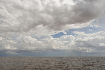 Cloudscape over Tonlé Sap Lake in Cambodia on a sunny day