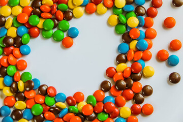 heart made of candy on a white background. the heart of the bright jelly beans. a sweet gift for...