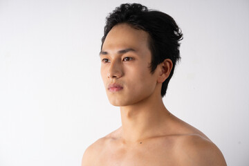 Fototapeta na wymiar Portrait of handsome young man with clean muscles and skin