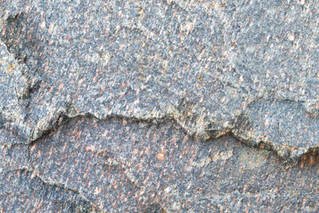 Dark grey granite untreated surface. Natural background. Stone texture. Copy space, place fot text.