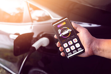Using mobile smartphone device refueling electric vehicle EV car mock UI application display...