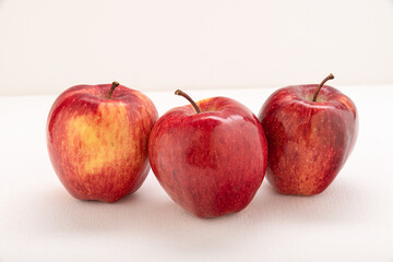 Apples are red-yellow, juicy on a light background
