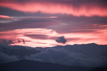 Fototapeta na wymiar pink red clouds in sunrise mountain mitsikeli in winter moring ioannina greece
